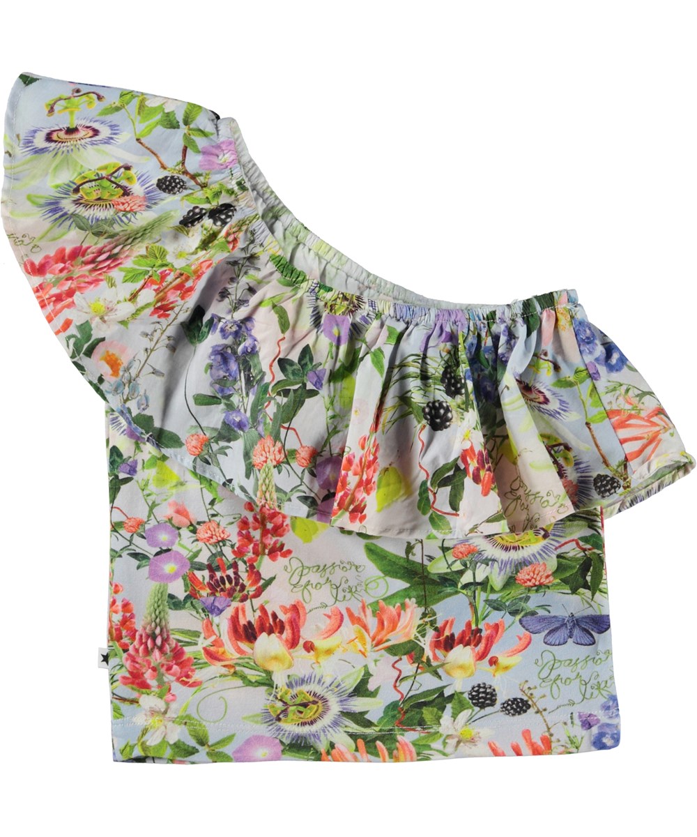 Raelyn - Passion For Life - Kort asymetrisk topp med volangkant oh blommor.