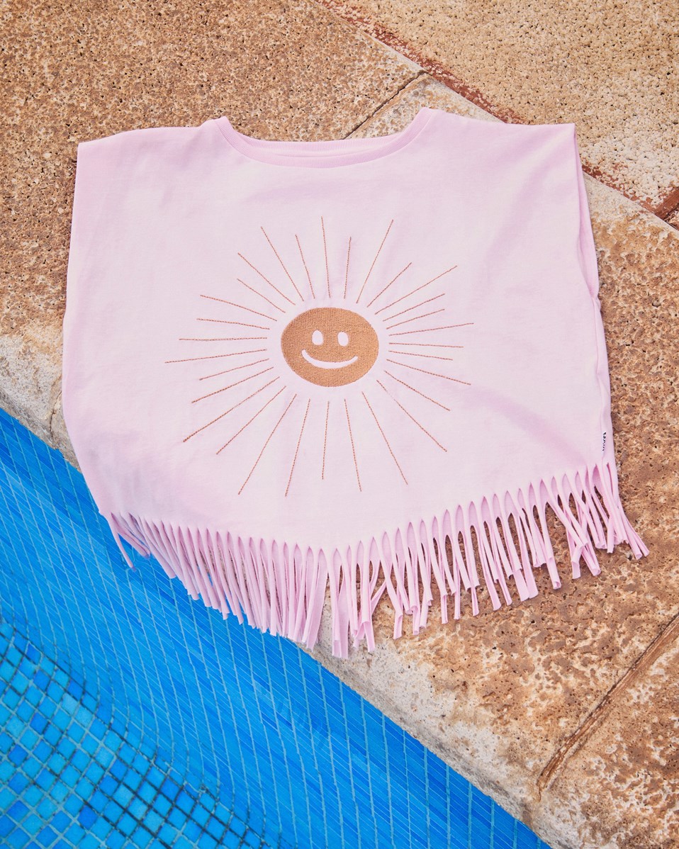 Rassita - Glowing - Rosa oversized topp för barn i ekologisk bomull med ribbad halsringning och fransar längst ner.