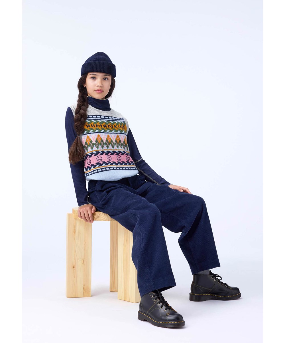 Grace - Kind Argyle - Multifärgad stickad väst för barn gjord av ull.