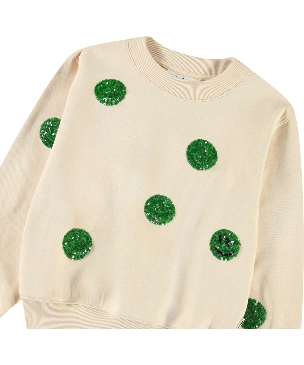 Marge - Brazilian Sand - Beige sweatshirt med paljetter för barn i mjuk ekologisk bomull med ribbade kanter vid halsen, ärmar och nederkant på tröjan.