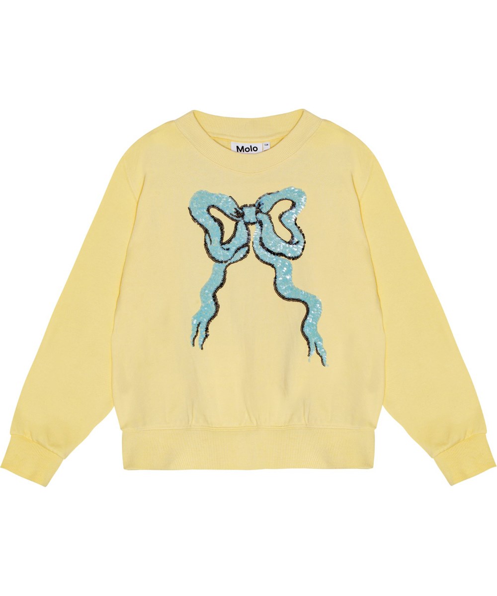 Marge - Sequin Bow - Ljusgul ekologisk bomullssweatshirt med oversized passform och paljetter i form av en rosettbrodyr.
