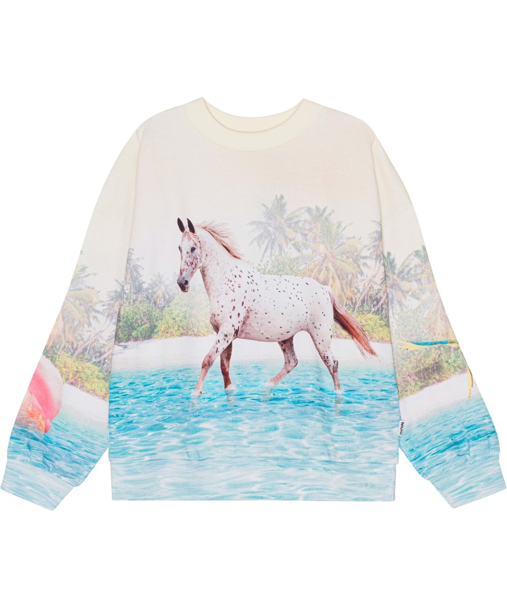 Maxi - Island Horse - Råvit sweatshirt i ekologisk bomull med en häst på en strand. 