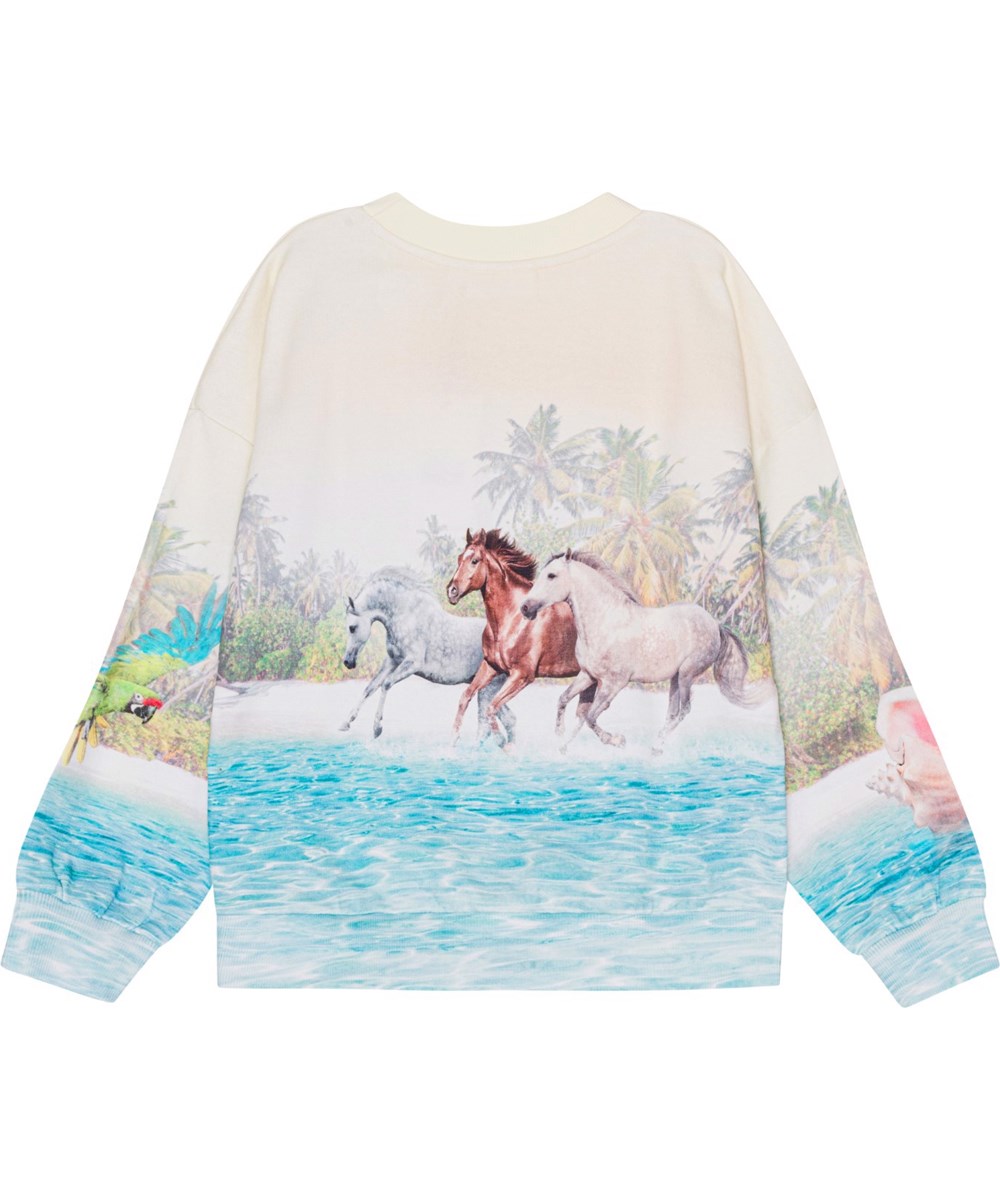Maxi - Island Horse - Råvit sweatshirt i ekologisk bomull med en häst på en strand. 