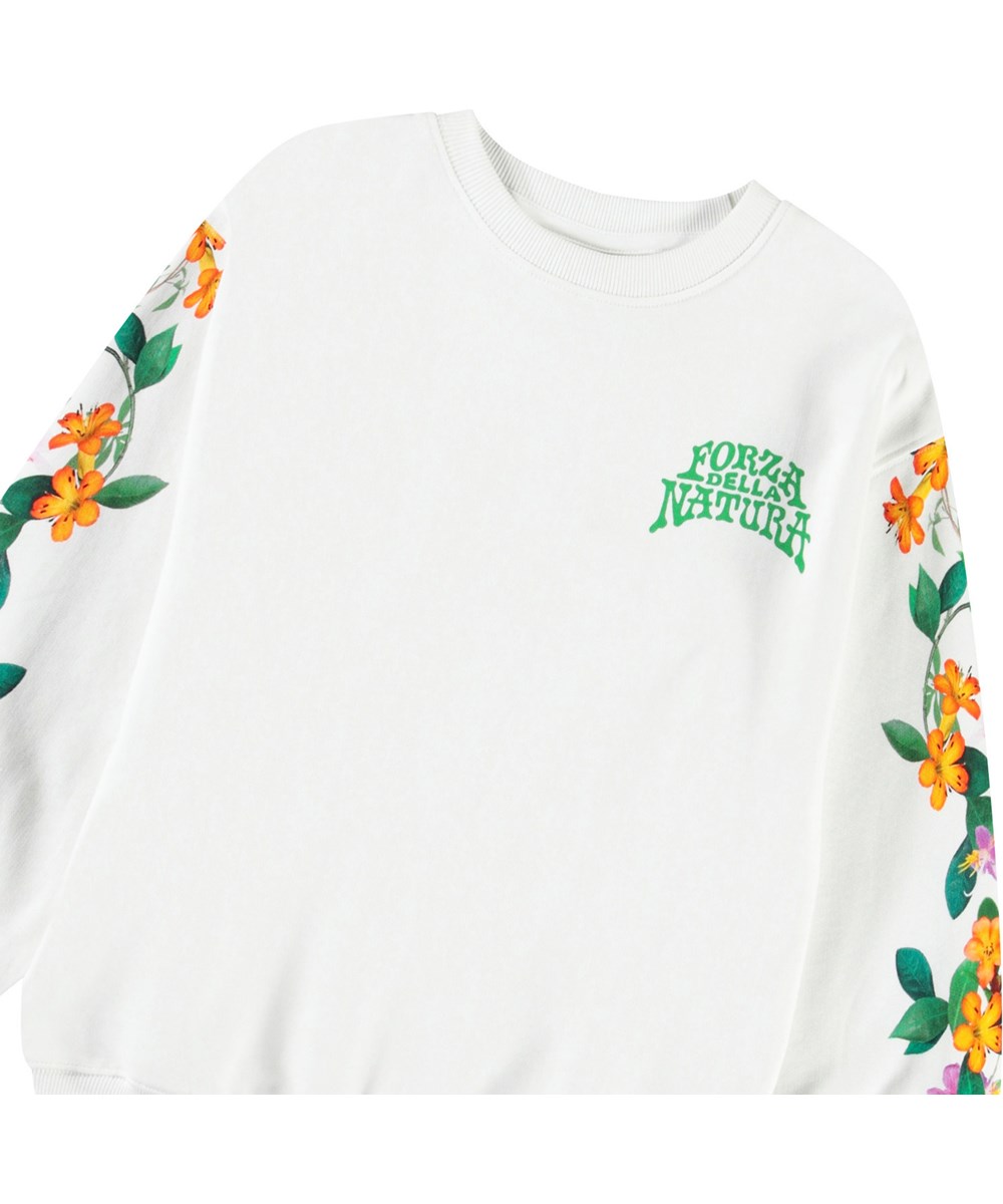 Monti - Jungle Flowers - Vit tröja med tryck för barn i mjuk ekologisk bomull med ribbade kanter vid halsen, ärmar och nederkant på tröjan.