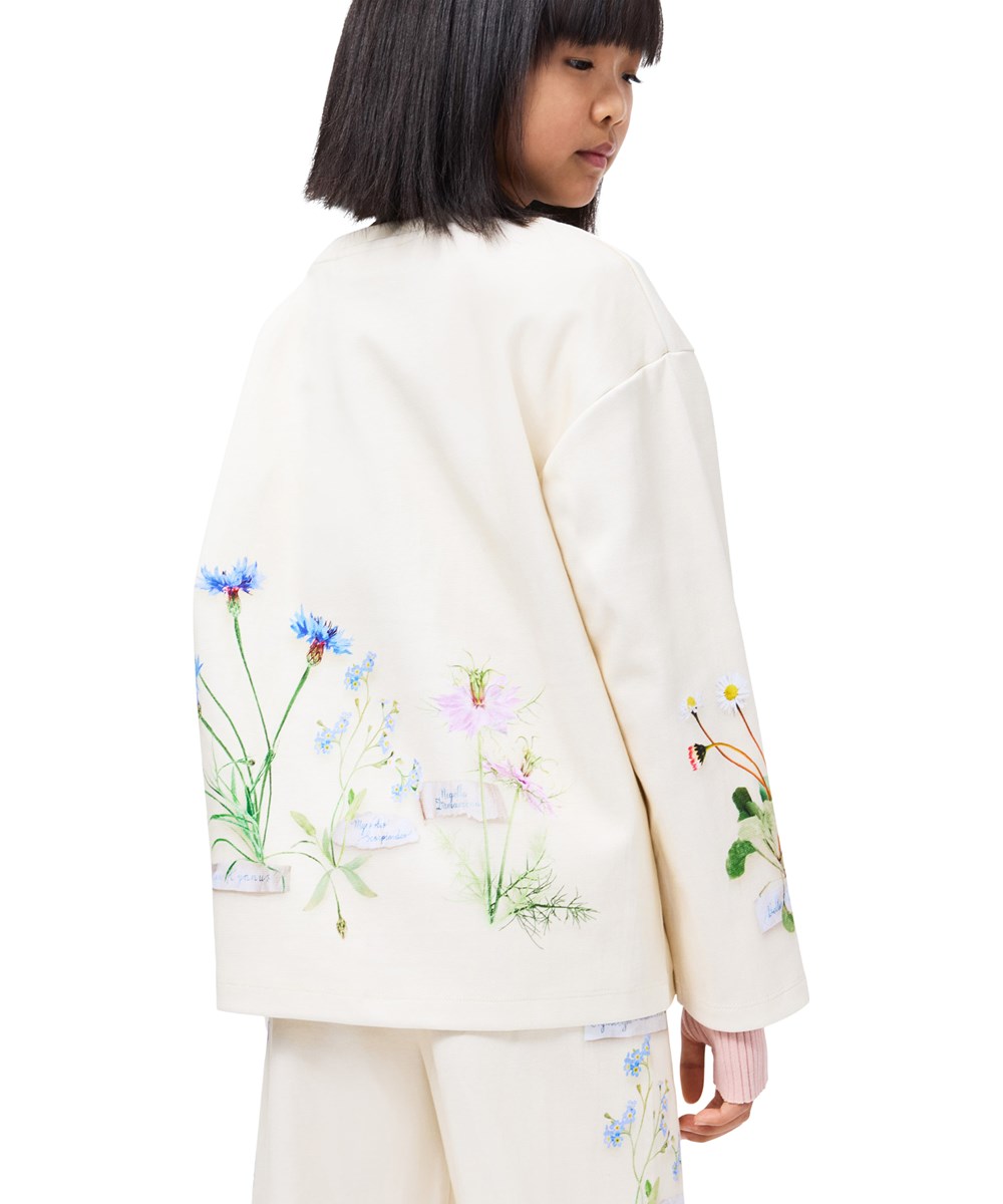 Mountoo - Flora Collector - Off-white sweatshirt för barn i ekologisk bomull med ett blommigt mönster