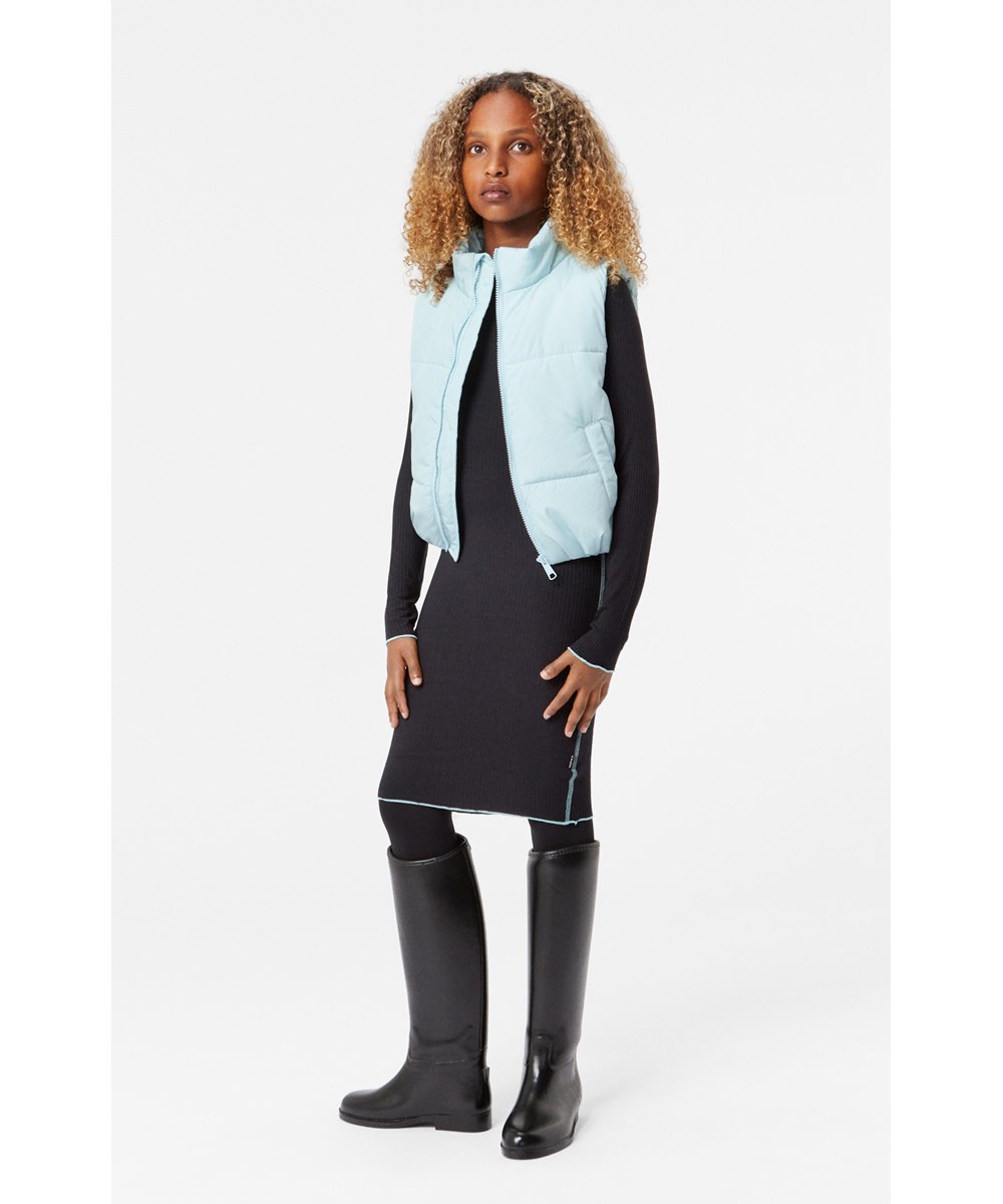 Cai - Black - Black long-sleeved ribbed jersey dress with close-fitting silhouette and light blue overlock edges.