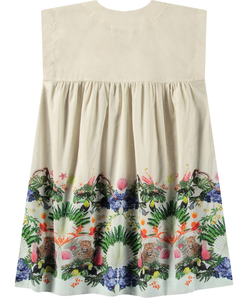 Cajla - Magic Sand - Beige loose dress for children in organic cotton with wide straps and v-neckline.