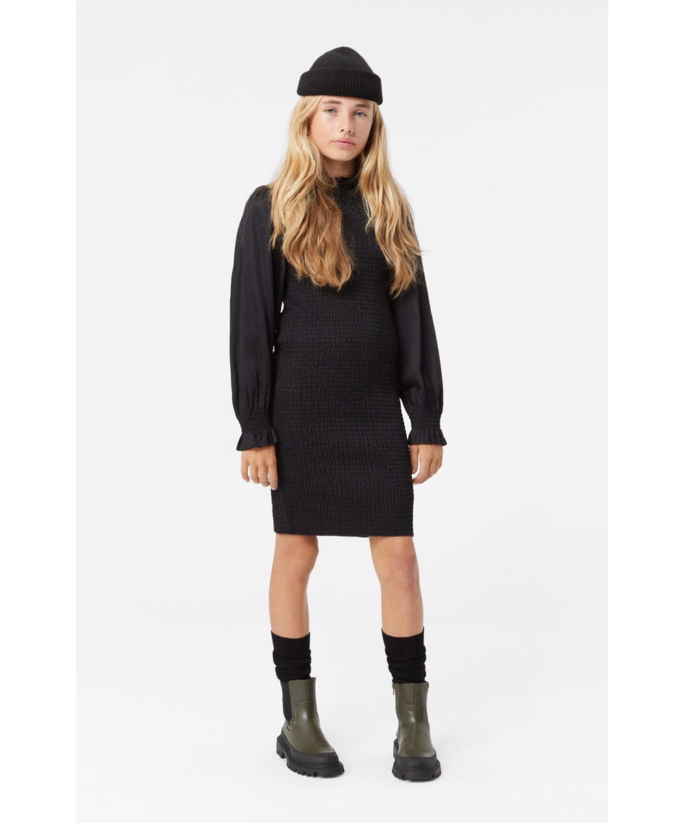 Calesta - Black - Black knee-length dress in soft viscose with smocking for snug fit.