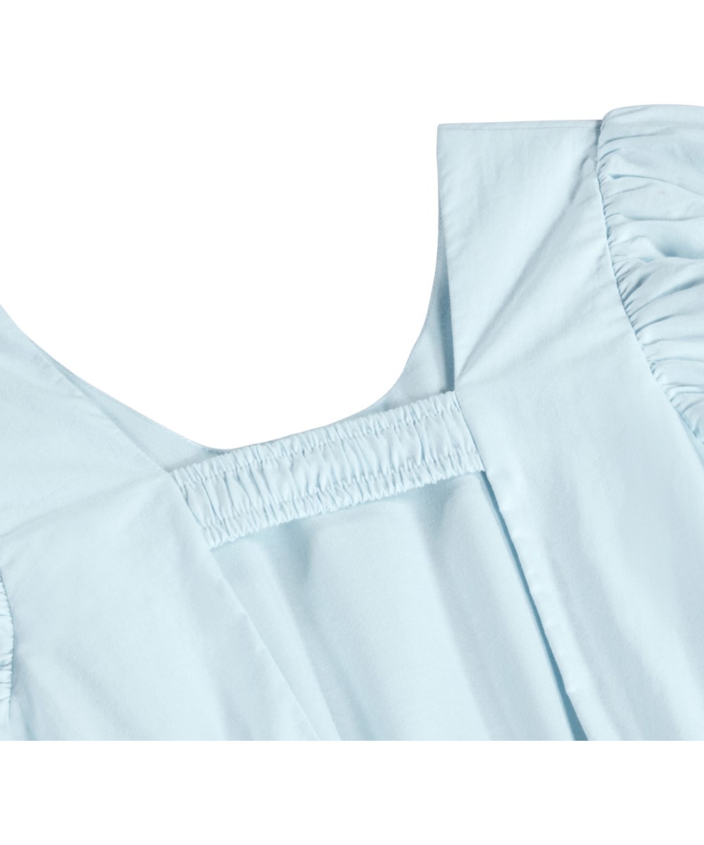 Cally - Morning Sky - Light blue dress for chlldren made of organic cotton with an open back 