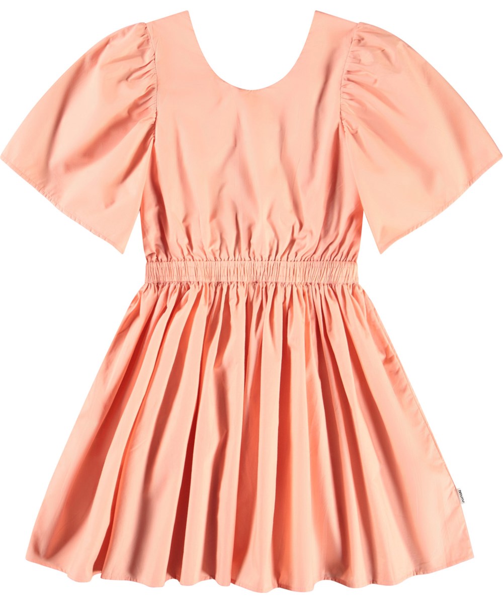 Cally - Peach - Light orange knee-length dress for children in organic cotton with a round neckline.