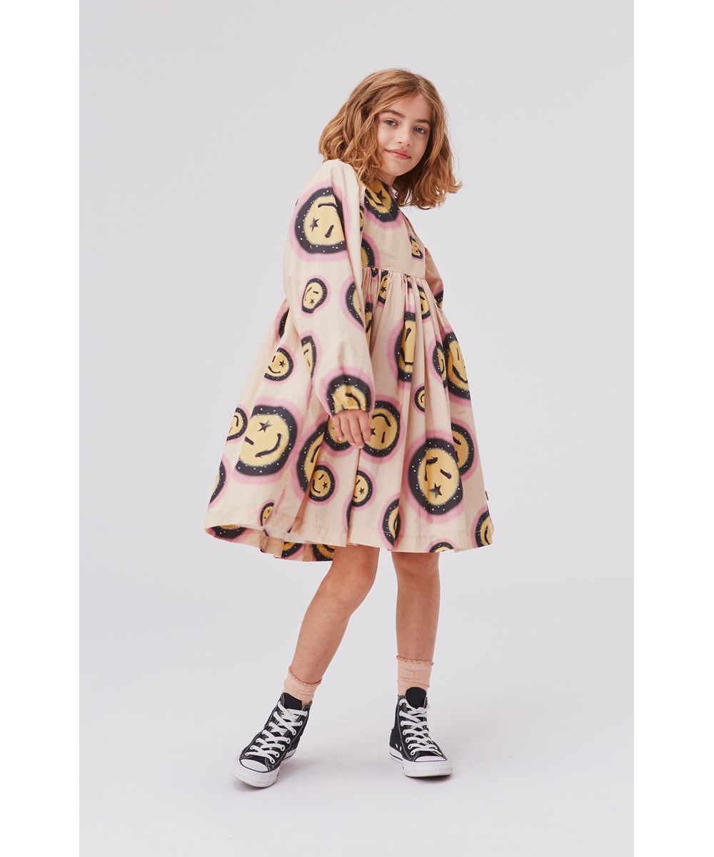 Caly - Space Happy AOP - Light yellow organic dress with smiley face print 