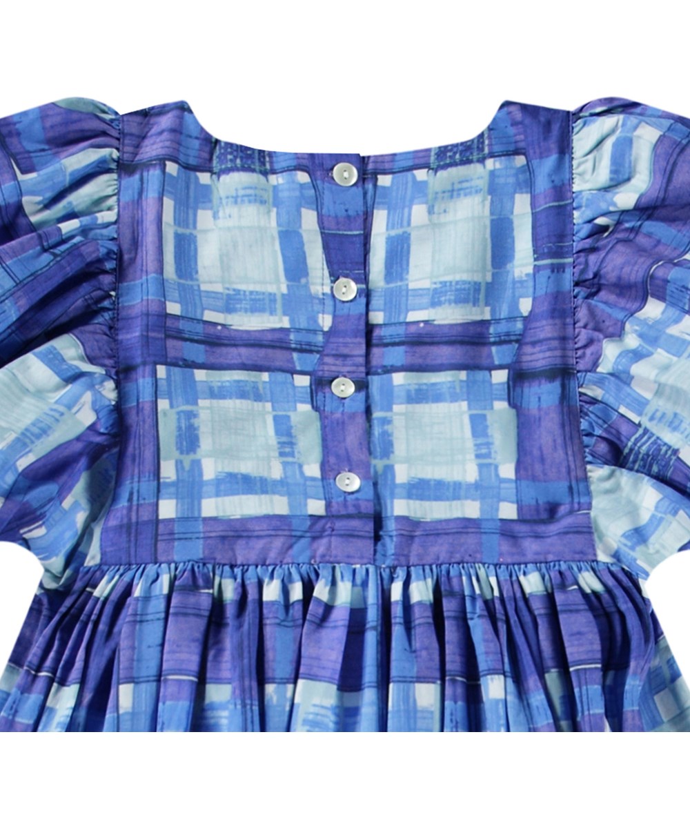 Calyita - Blue Checks - Checked dress for children in shades of blue in organic cotton with a round neckline.