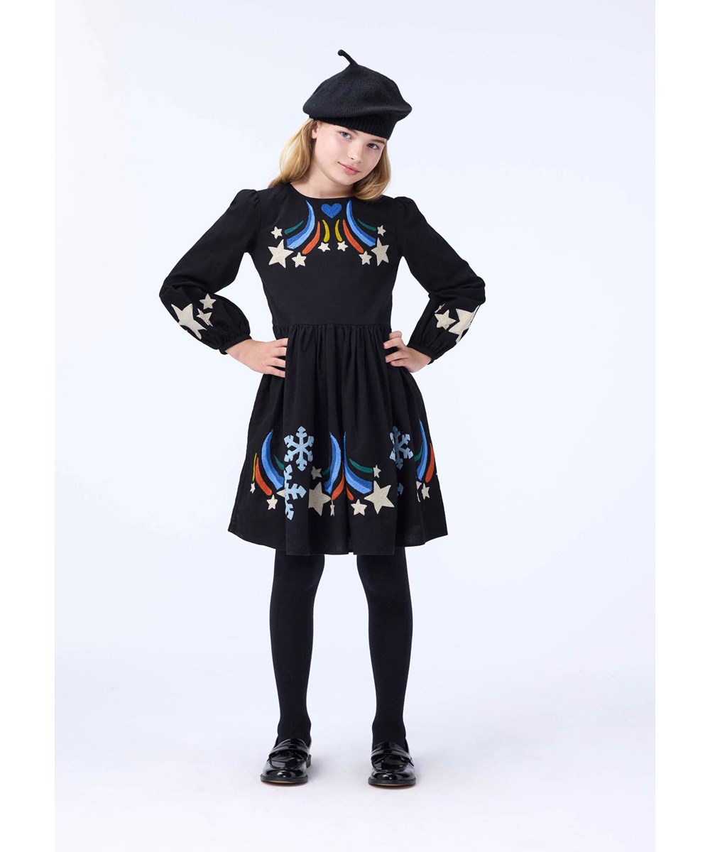 Camma - Shooting Star - Knee-length black dress for children made of cotton with embroidered shooting stars and ice crystals.