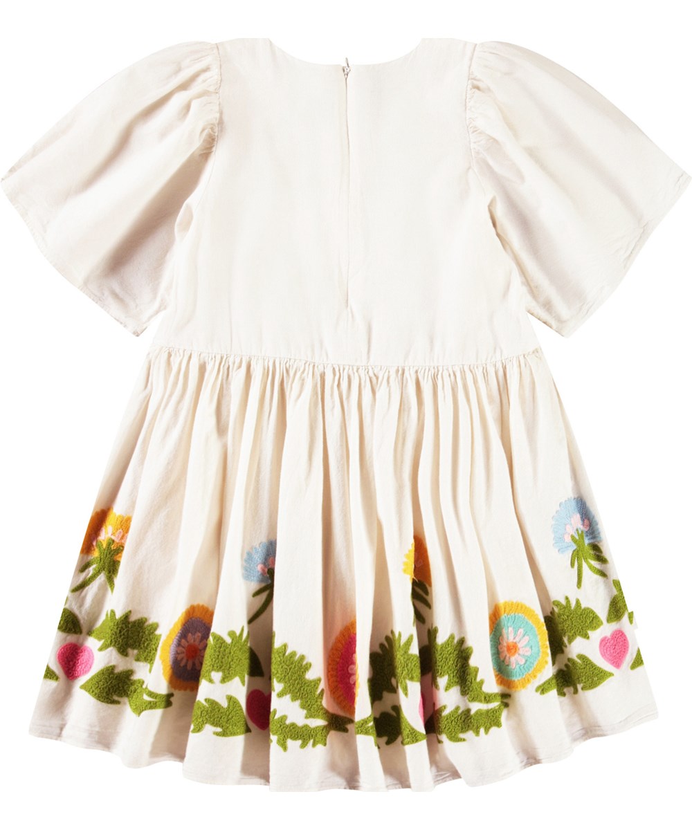 Carlin - Dandelion Border - Off-white knee-length dress for children in a soft cotton with a round neckline and butterfly sleeves.