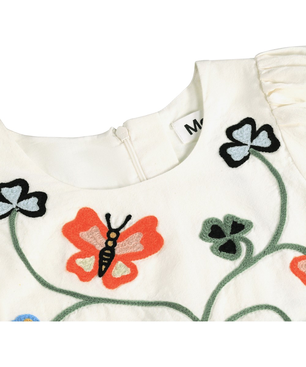 Carlin - Nature Border - Off-white dress for children made of organic cotton with a butterfly embroidery