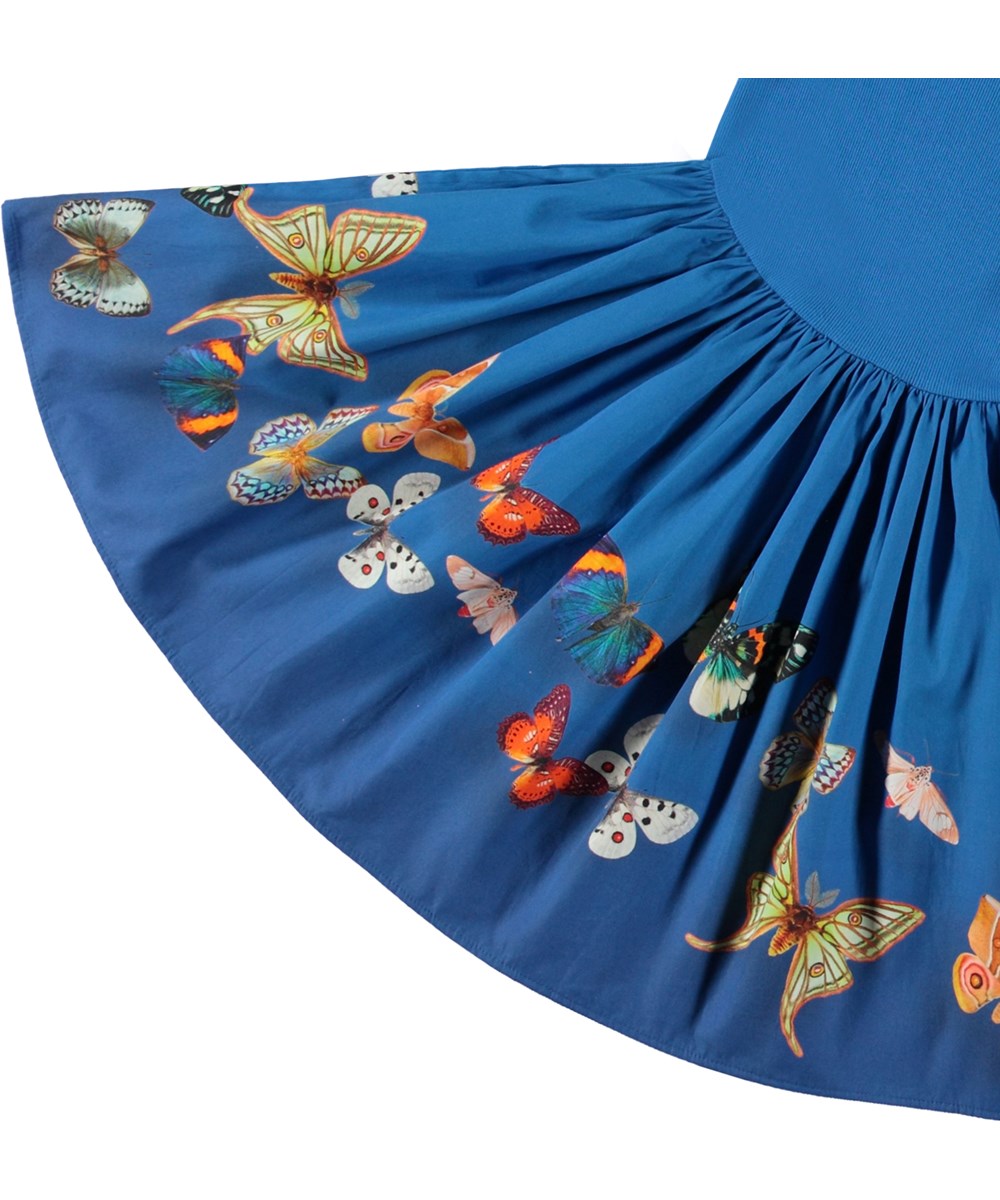 Casie - Night Butterflies - Blue organic cotton dress with ribbed jersey top and butterfly print.