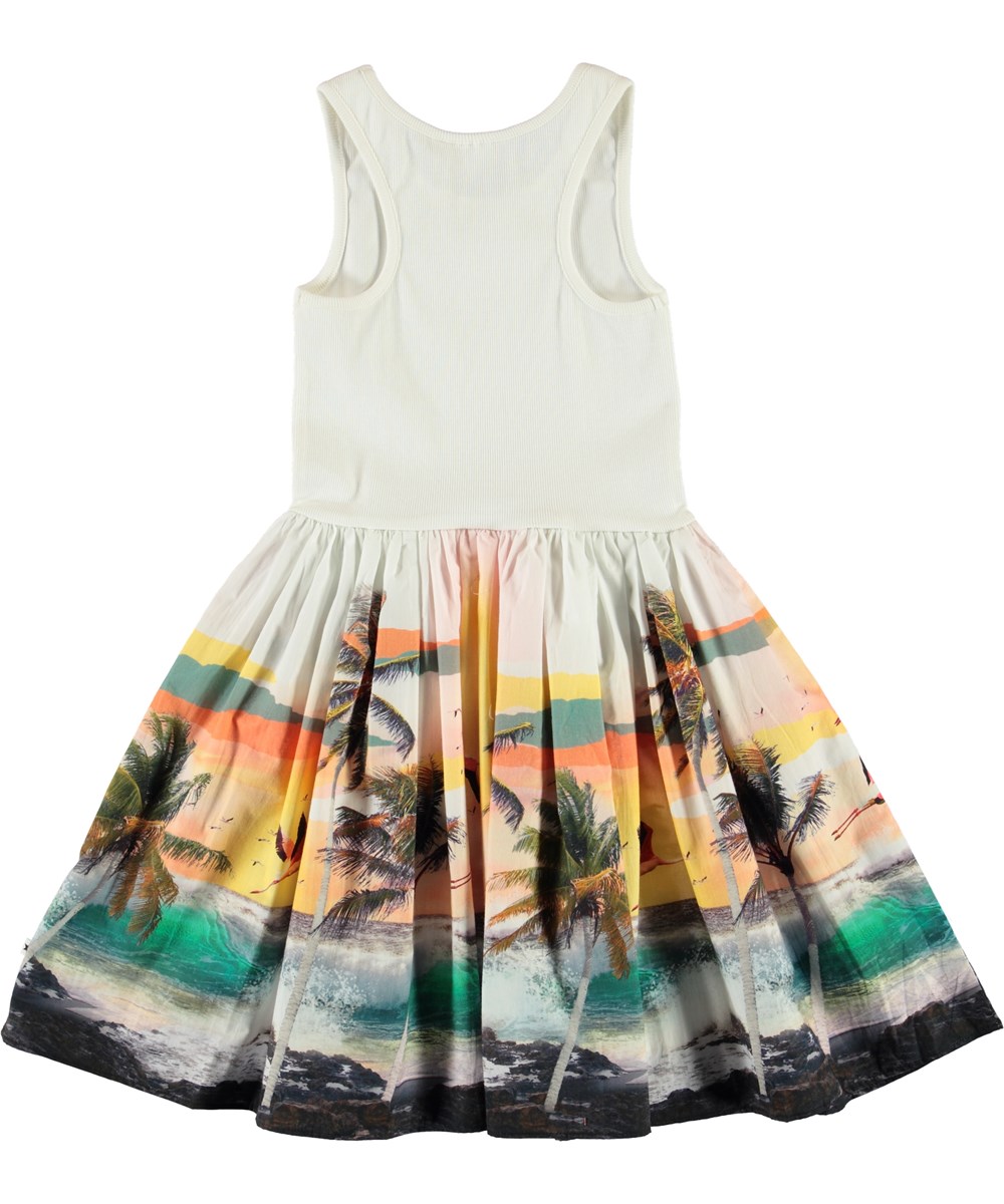 Cassandra - Stormy - White dress with palm trees and a beach 