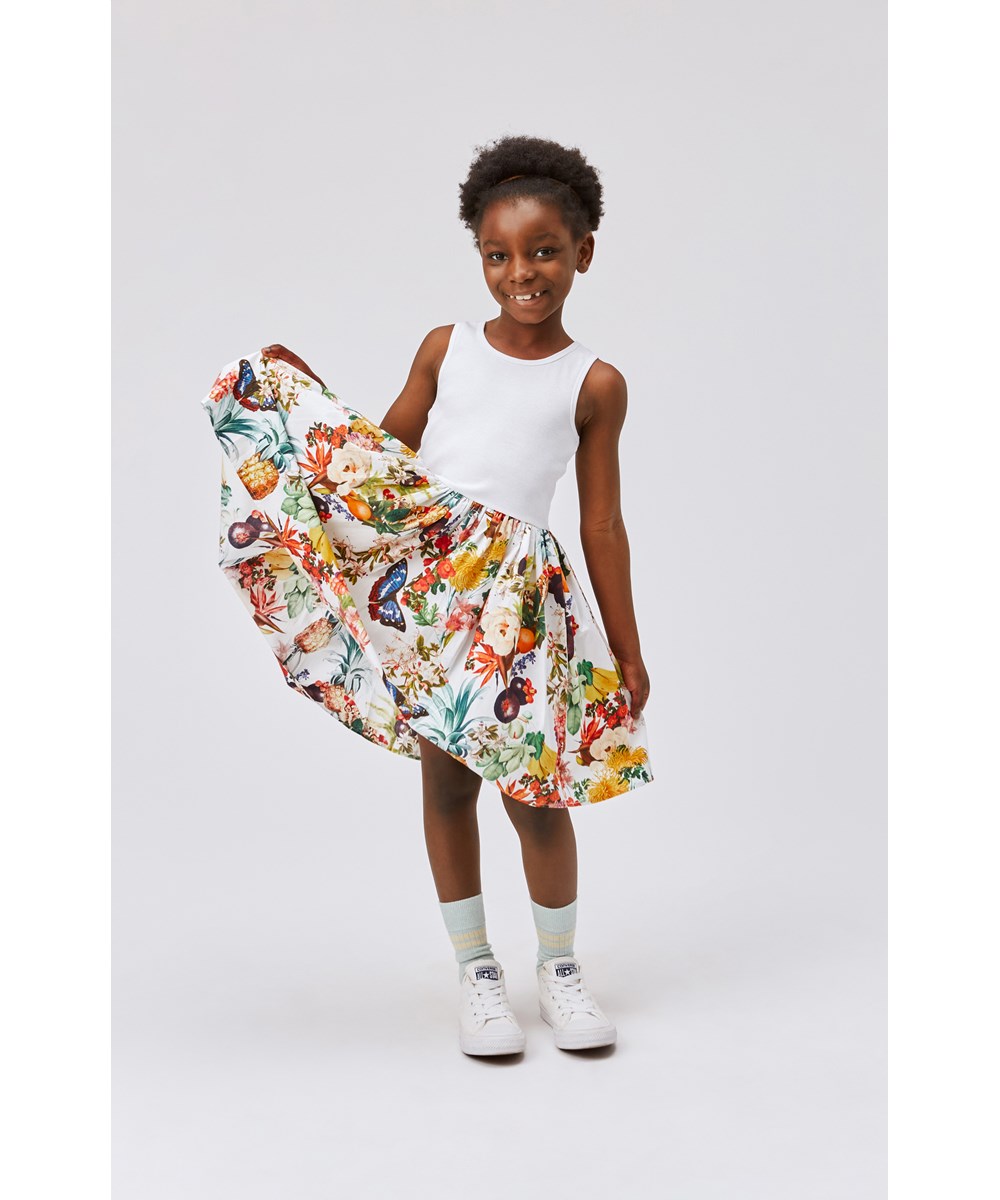 Cassandra - Tropical - White organic dress with poplin skirt tropical print