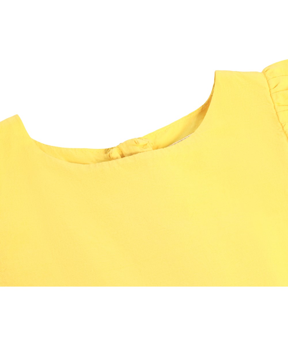 Caya - Sunshine - Yellow dress for children made of organic cotton with broderie anglaise