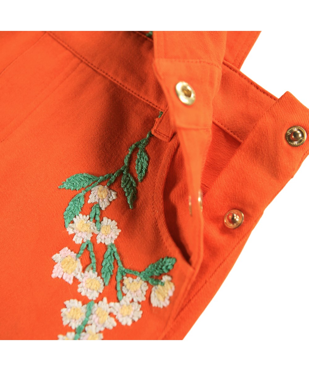Chakala - Rising Sun - Orange cotton dress for children with straps and beautiful embroidery.