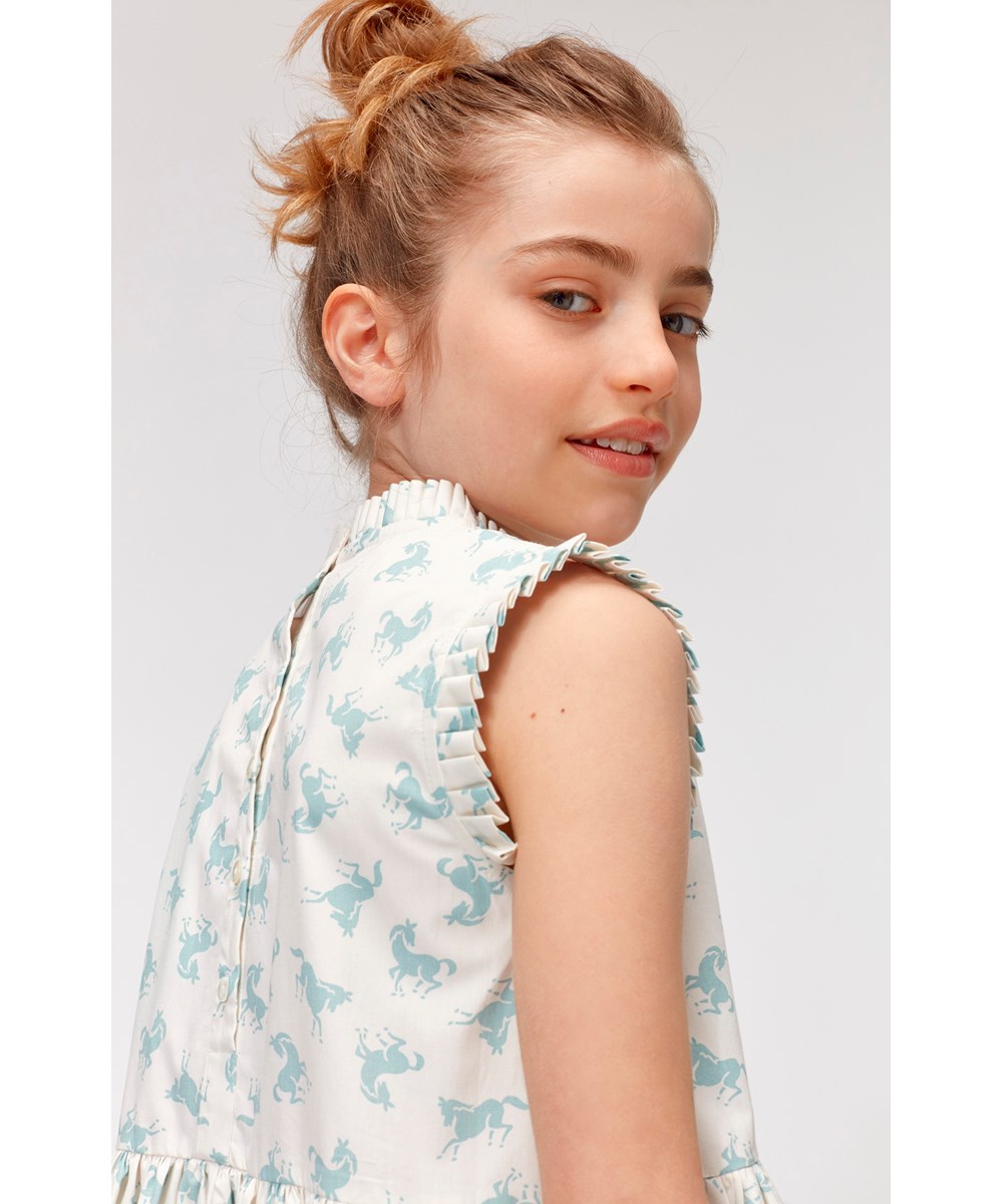 Charlette - Mini Horse Blue - White organic cotton dress with light blue horses 