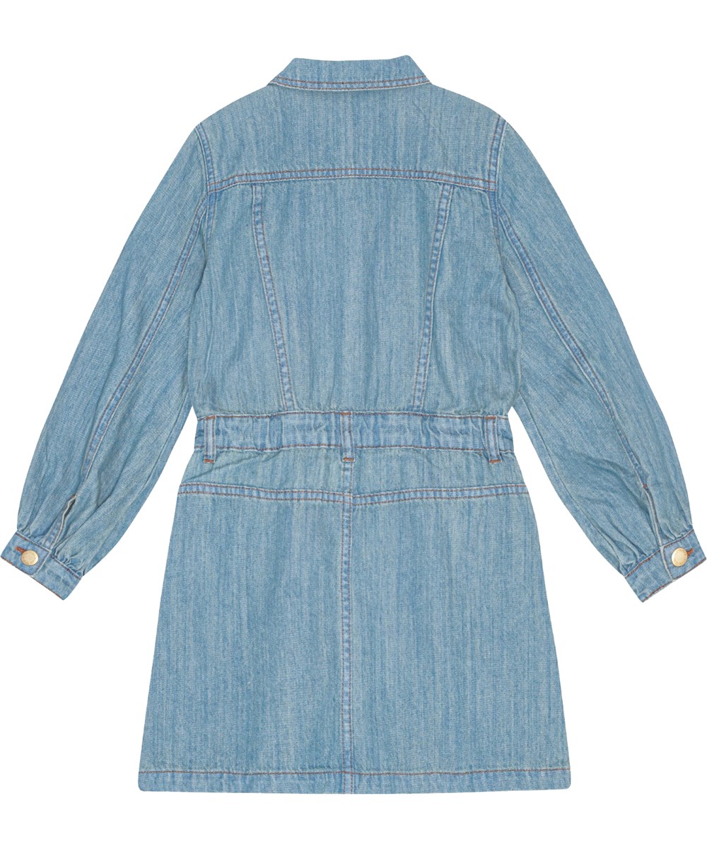 Chaya - Washed Denim Blue - Light blue denim dress with front pockets, long sleeves, and gold buttons.