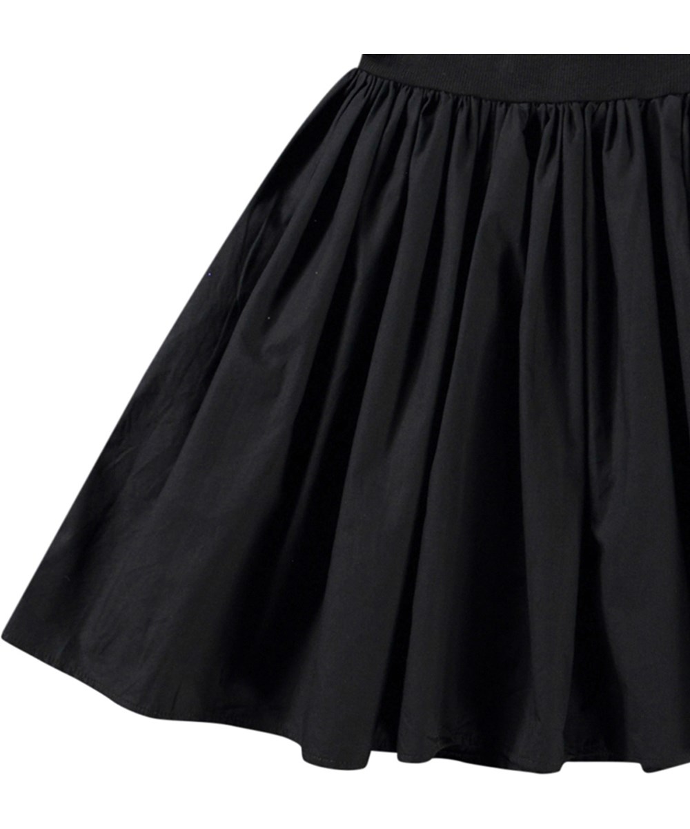 Chloey - Black - Black one-shoulder dress in organic cotton with a wide poplin ruffle.