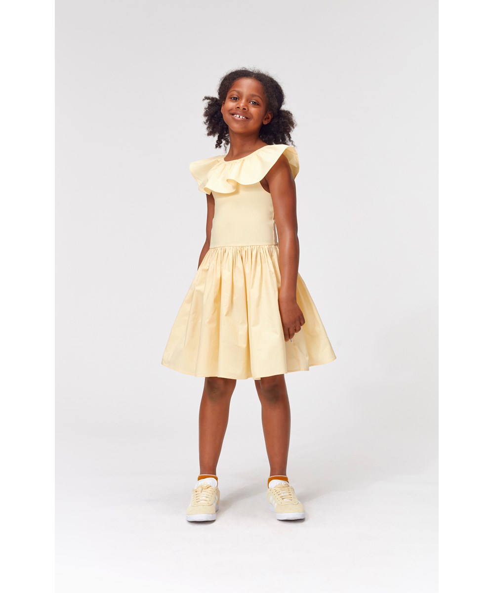 Christal - Impala - Light yellow organic dress with ruffle edge 