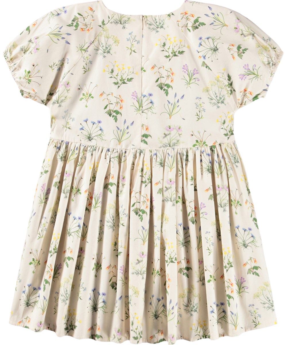Christen - Primavera - Off-white dress for children made of organic cotton with a floral print