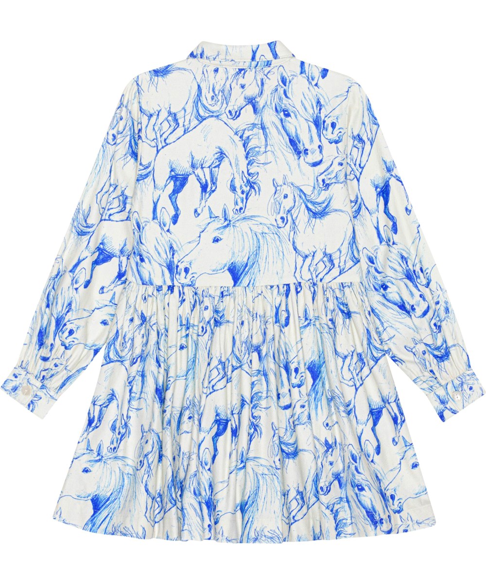 Christy - Blue Horses - Off-white, knee length dress with blue, all over horse print 