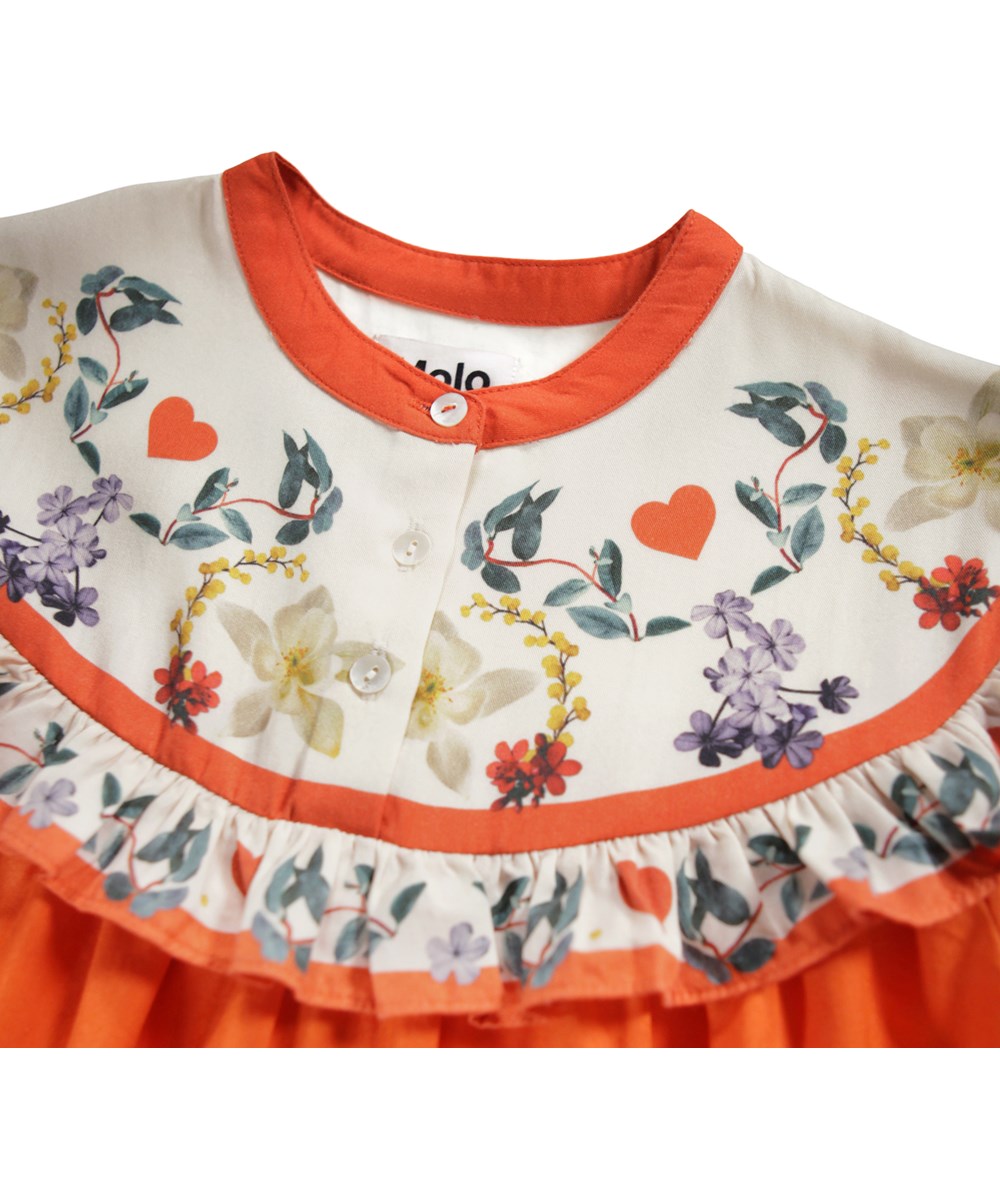 Cibbe - Alpine Flora - Orange knee-length dress for children made of viscose with a print of flowers on the yoke.