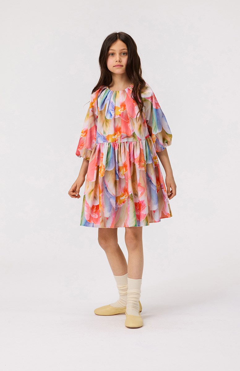Ciera - Be A Tulip - Multicoloured floral dress for children in organic cotton with pleats around the neckline.