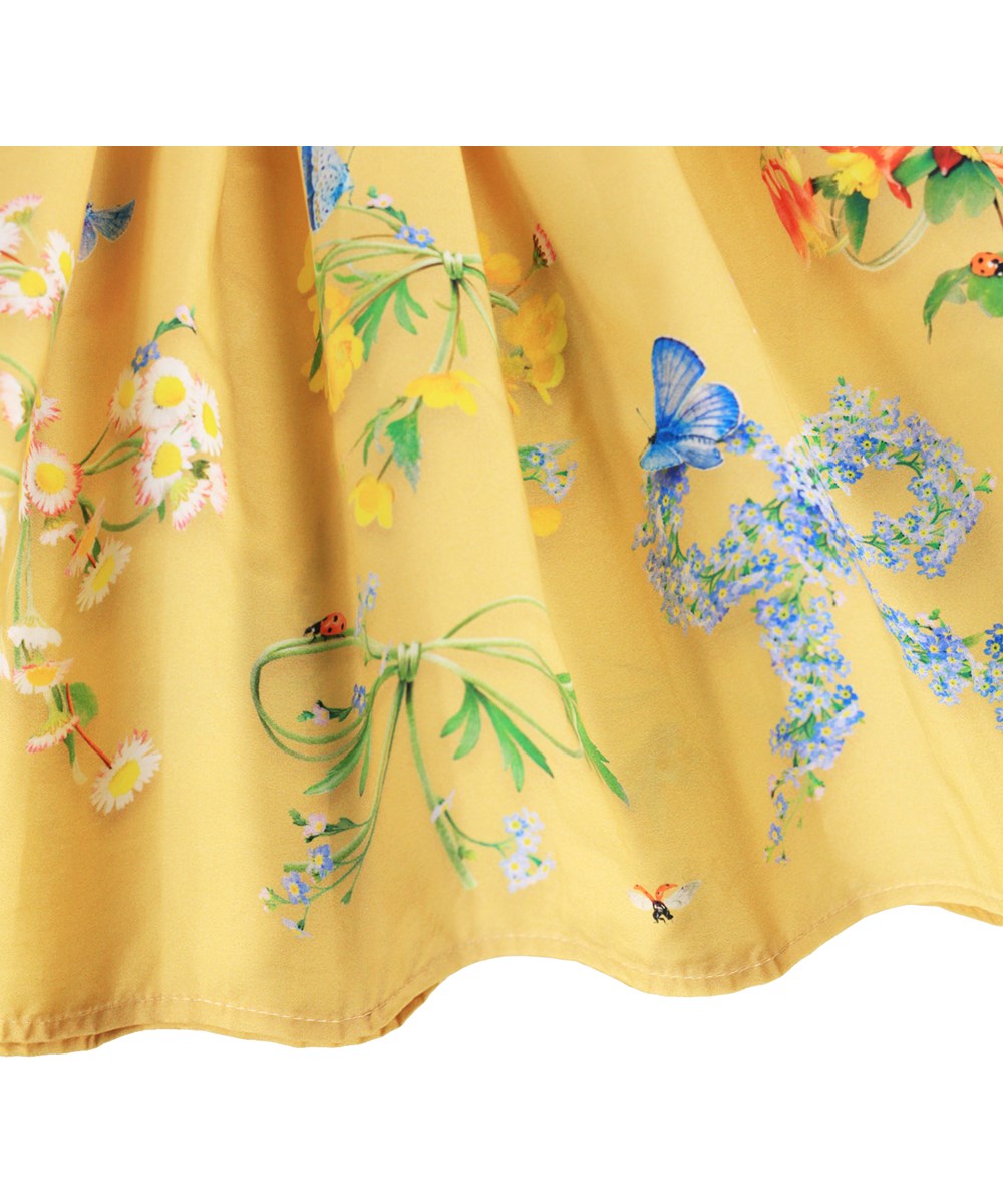 Cissa - Dressy Bows - Yellow dress for children made of organic cotton with a floral print
