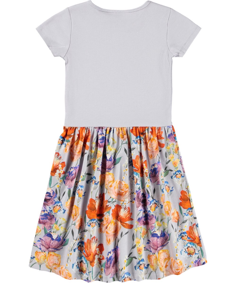 Cissa - Paper Flowers - Short-sleeved light purple dress  for children made of organic cotton with a print of flowers on the skirt.