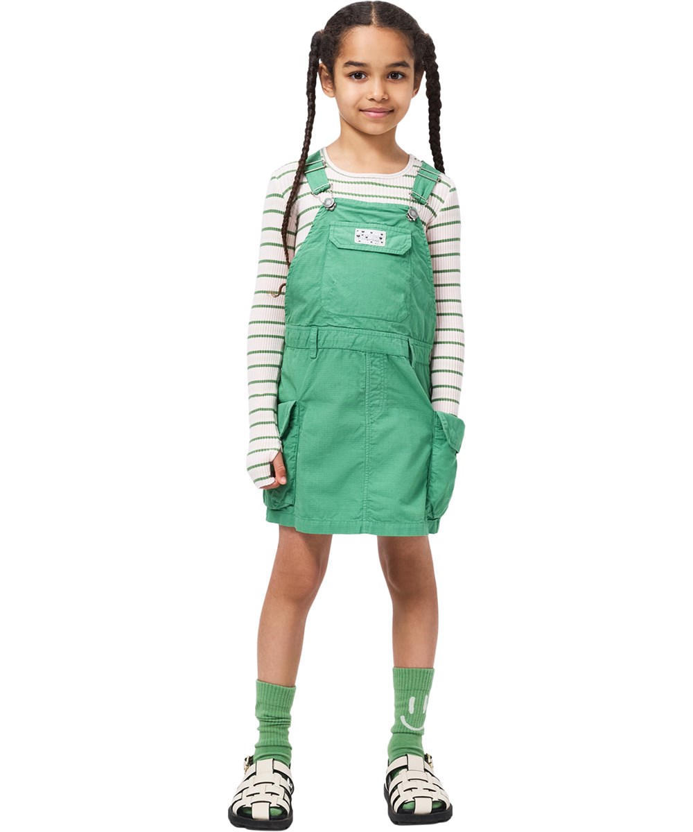 Clarice - Groovy Green - Green overall dress for children made of durable organic cotton with cargo pockets 