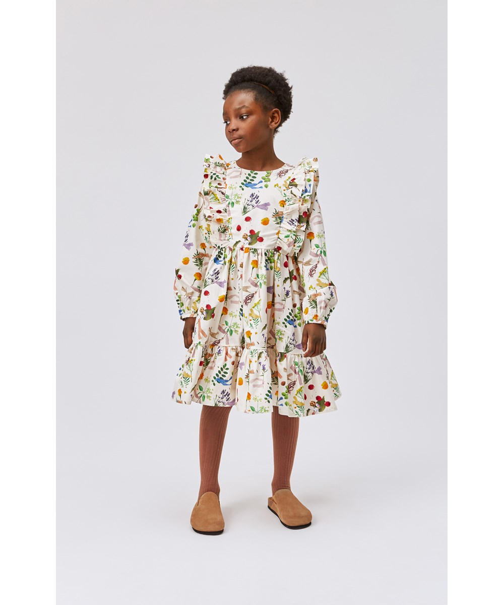 Clea - Plant Dye White - White organic dress in colourful flower print 