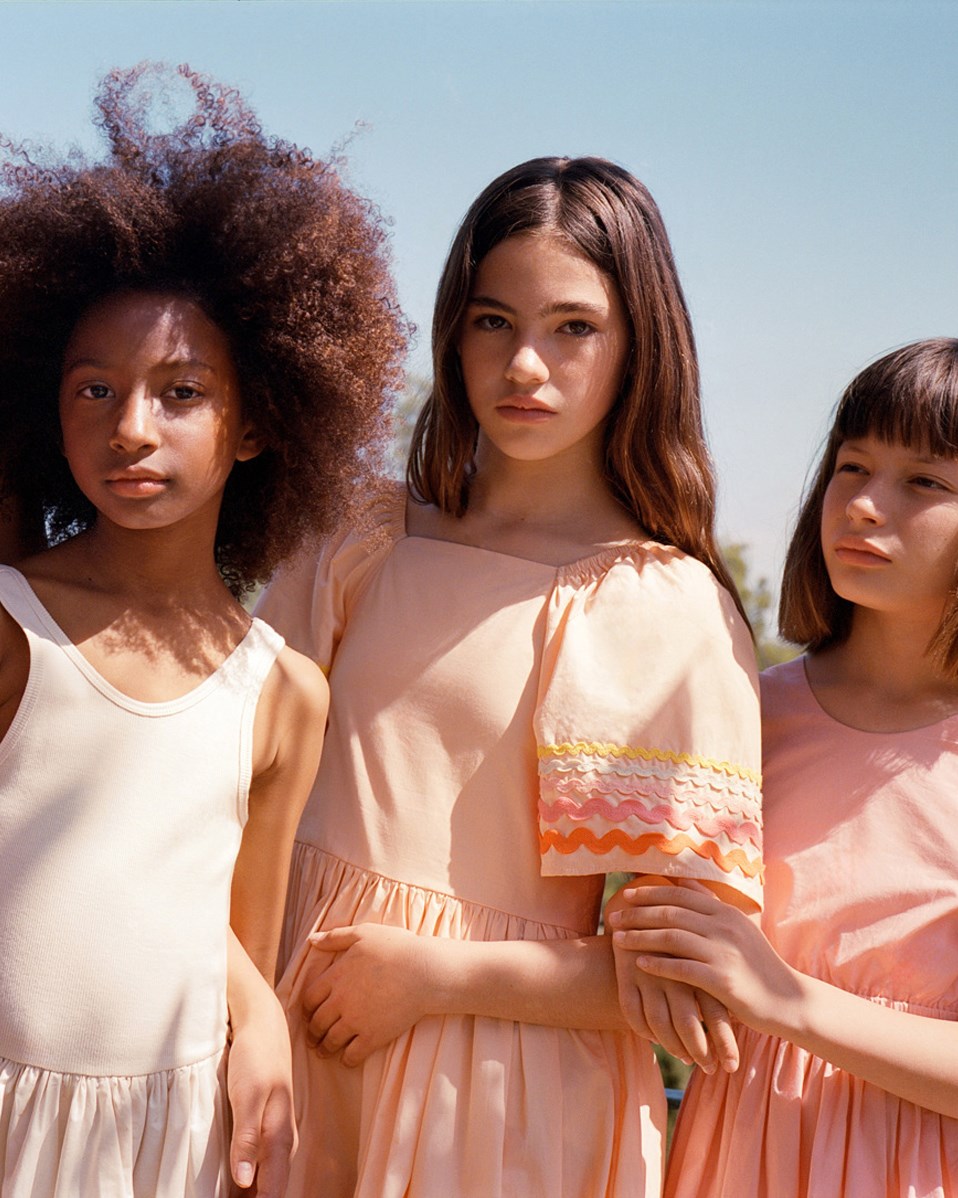 Clotilde - Pale Melon - Knee-length orange dress for children in organic cotton with wide butterfly sleeves.