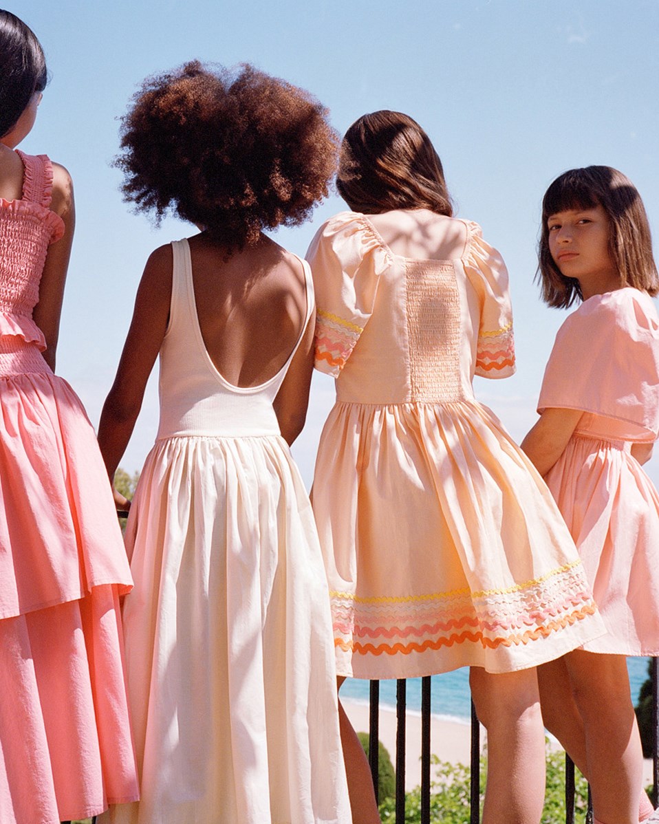 Clotilde - Pale Melon - Knee-length orange dress for children in organic cotton with wide butterfly sleeves.