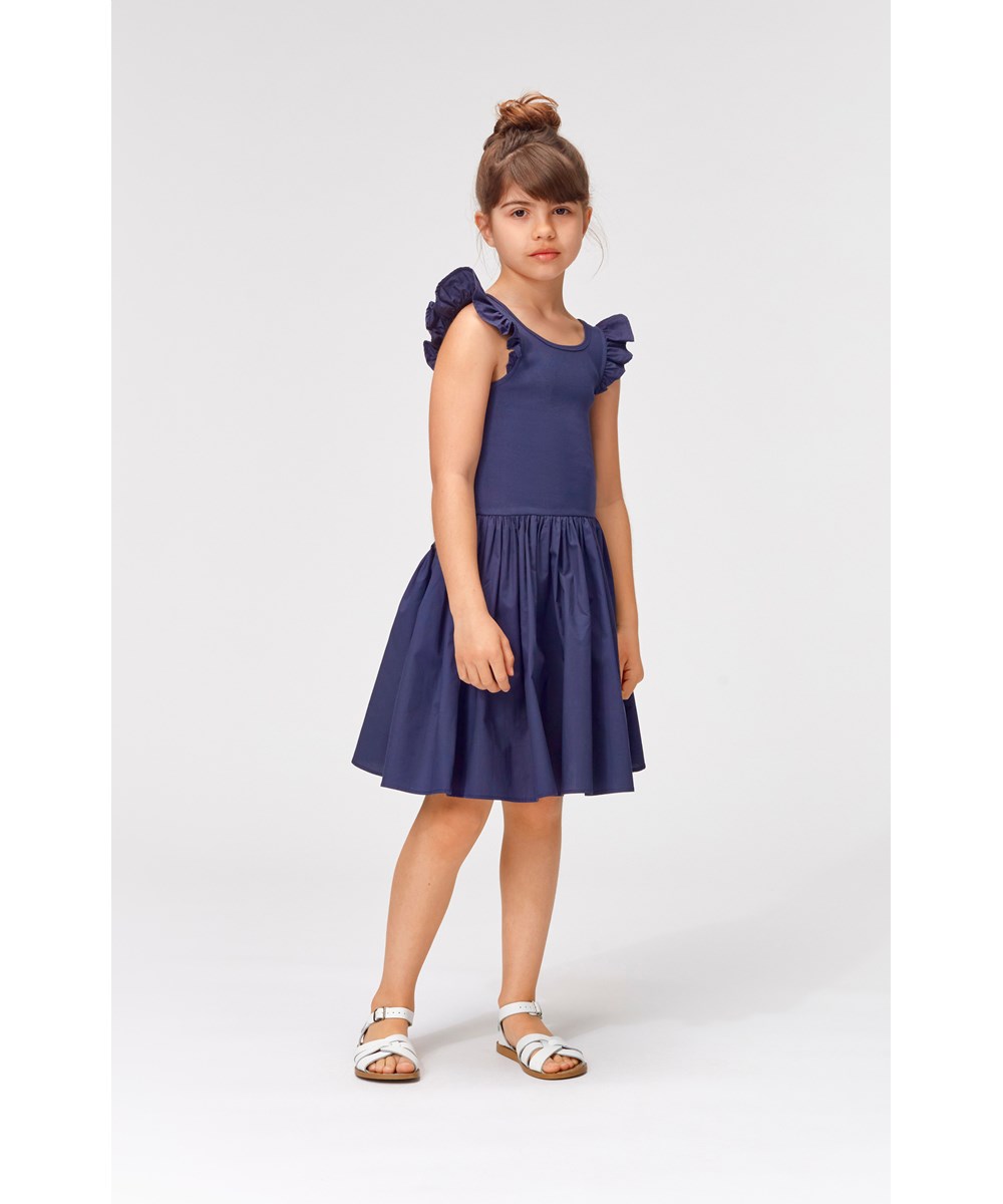 Cloudia - Blue Nights - Dark blue dress with ruffle edge on shoulder 