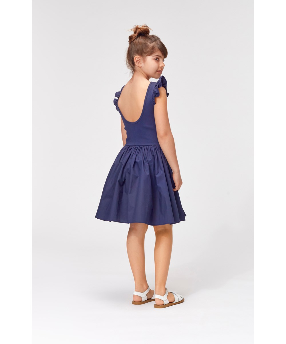Cloudia - Blue Nights - Dark blue dress with ruffle edge on shoulder 