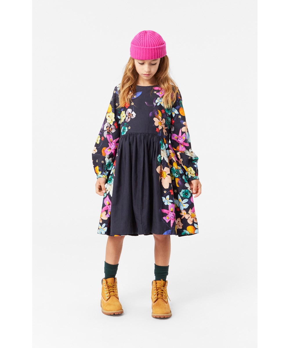 Como - Vertical Garden - Black cotton dress with round neckline, long sleeves, and floral print.