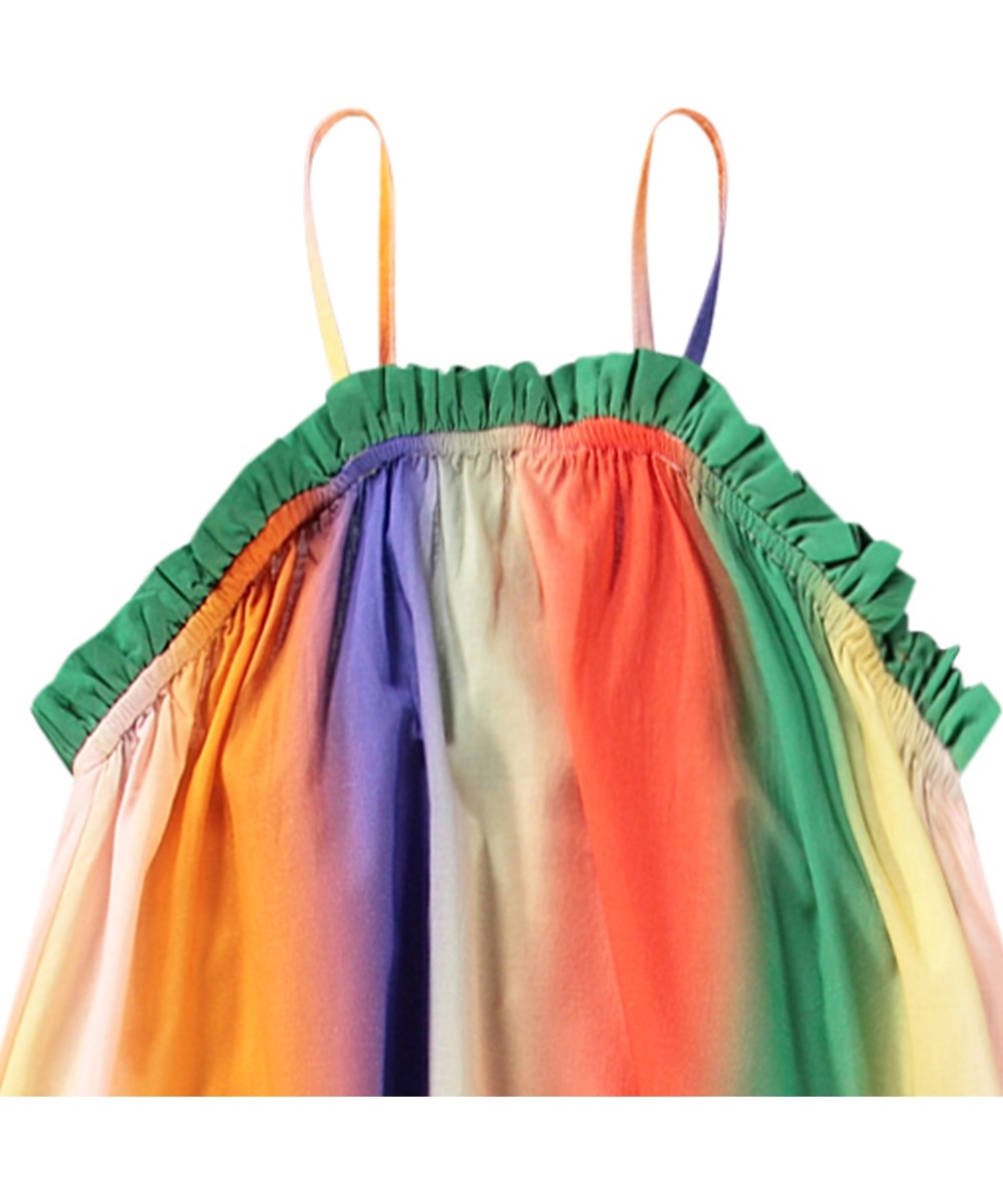 Connie - Big Rainbow - Rainbow-coloured loose dress for children in organic cotton with thin straps and frill edge.