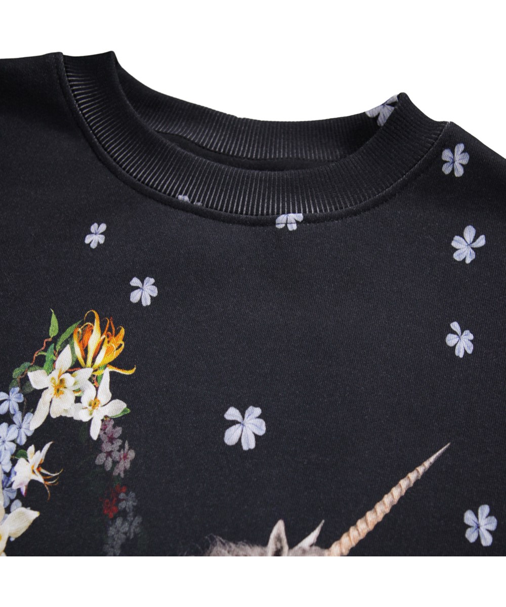 Cyrella - Flower Jump - Black sweatshirt dress for children made of organic cotton with a unicorn and flower print.