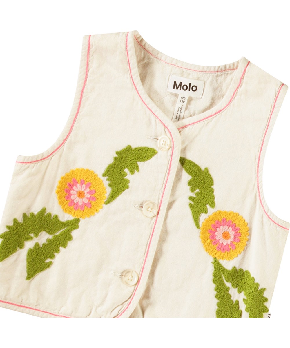 Heather - Fancy Dandelion - Sand-coloured, lined waistcoat with embroidery for children in soft cotton with a round neckline, button closure at the front, and pink stitching.
