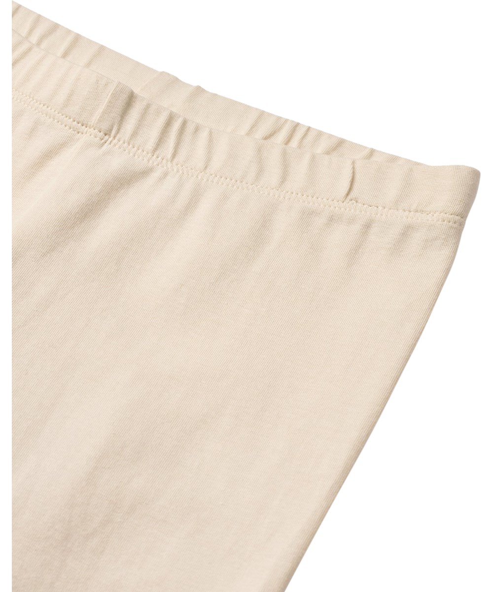 Nica - Summer Sand - Off-white leggings for children made of organic cotton