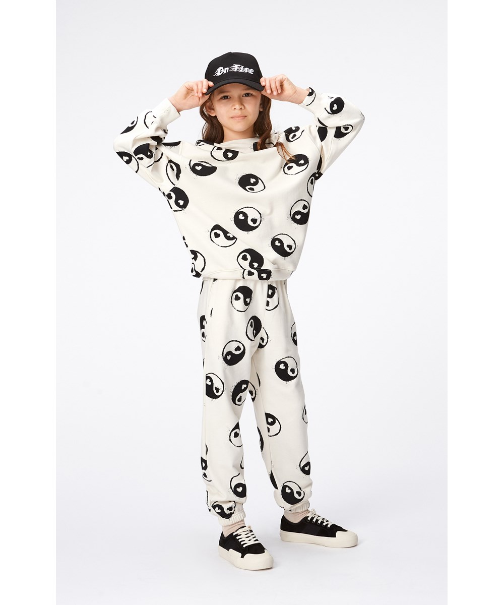 Adan - Simple Yin Yang - Off-white trousers in organic cotton with yin/yang symbols