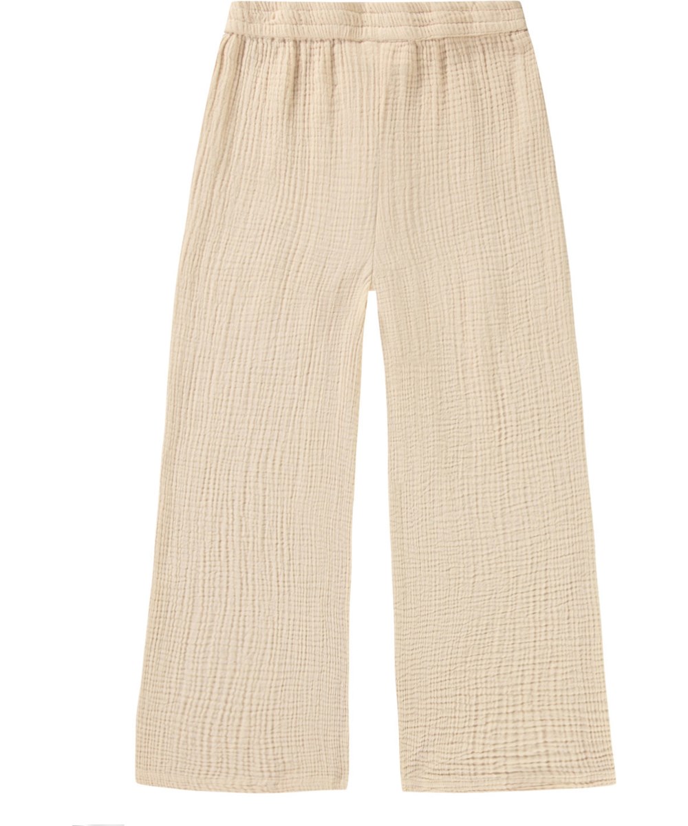 Agatha - Brazilian Sand - Loose summer pants in sand-coloured crinkled cotton for children.