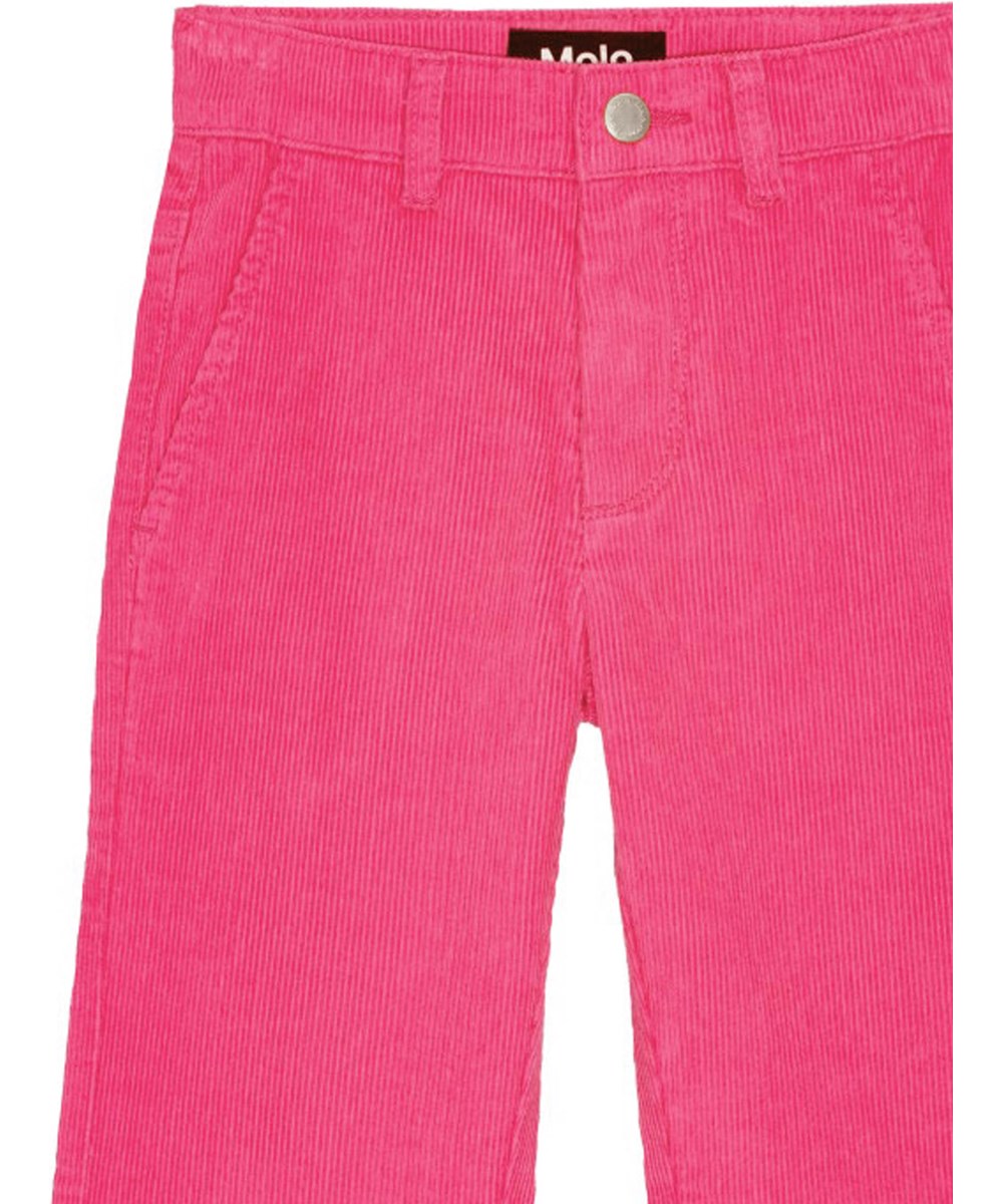 Aida - Shocking Pink - Flared pink corduroy trousers with pockets and adjustable waist.