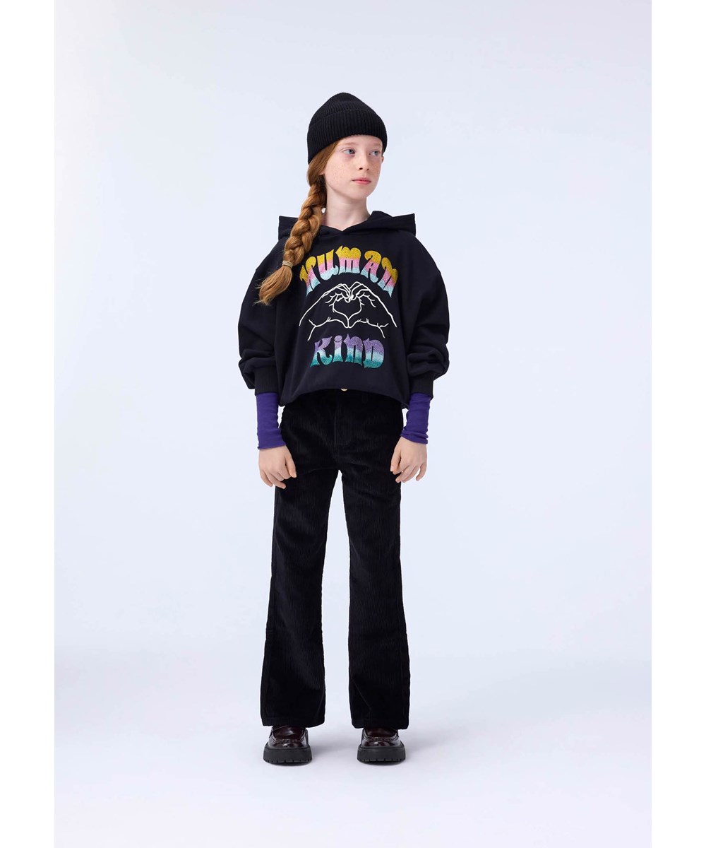Aida - Black - Black pants for children made of soft cotton velvet in a trumpet-shaped silhouette.