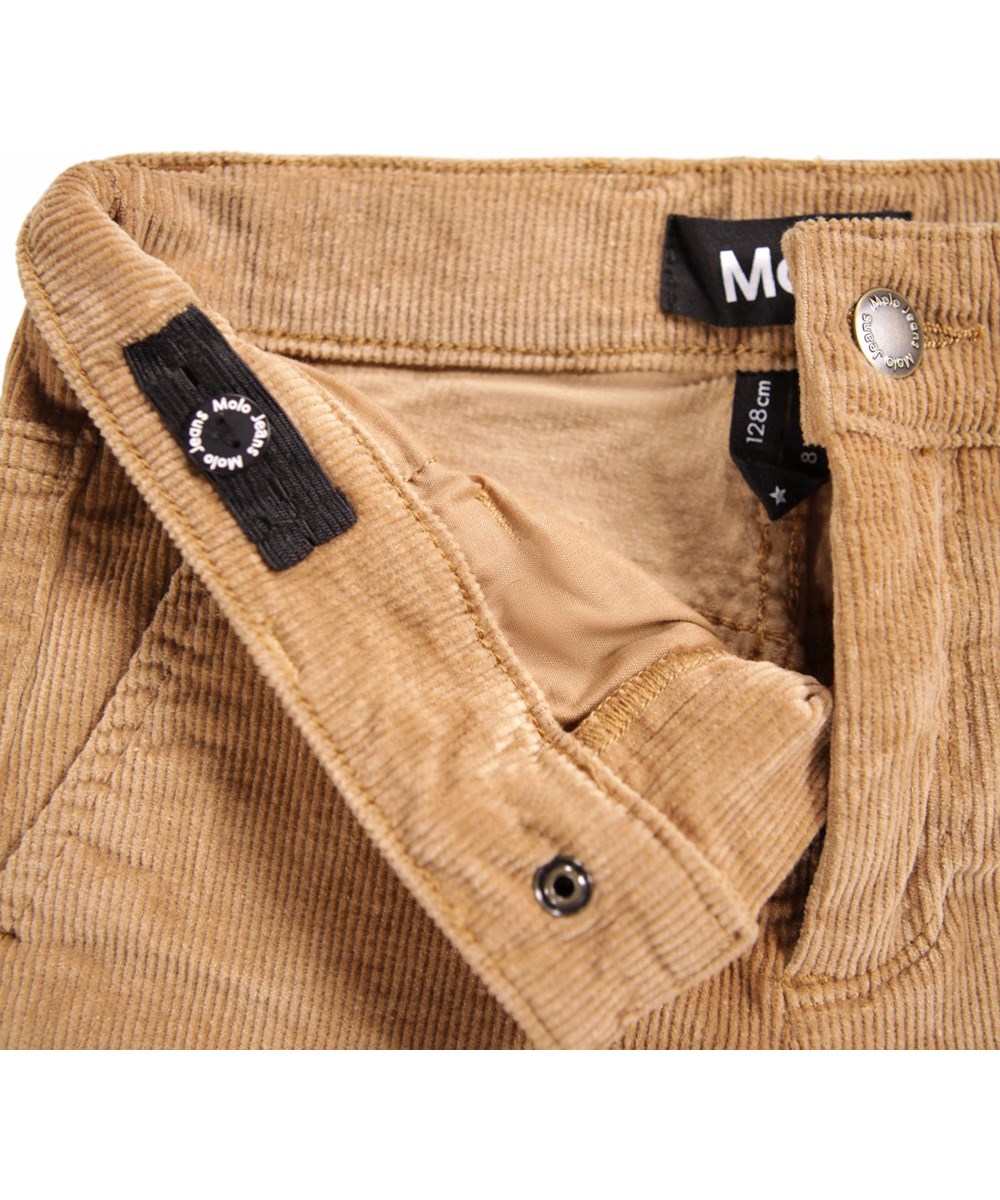 Aida - Pomeranian - Light brown pants for children made of soft cotton velvet in a trumpet-shaped silhouette.
